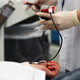A woman donating blood at a clinic in Germany.